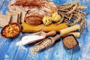 Selection of whole grain foods on blue table